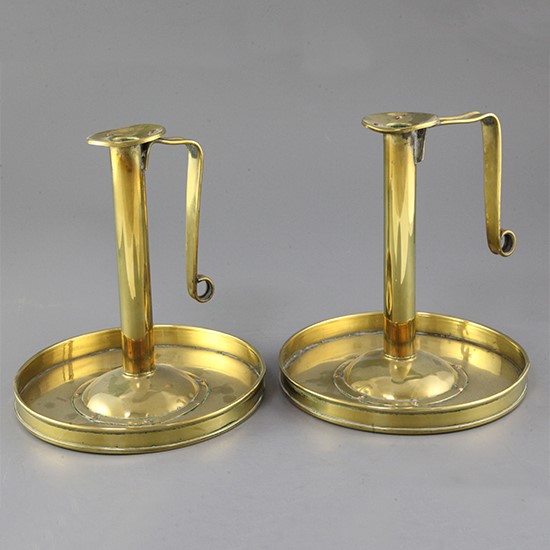 A pair of Arts & Craft brass and copper rivetted chambersticks 22cm